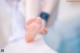 A close up of a person's bare feet on a table.