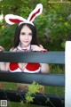 A woman in a bunny costume posing for a picture.