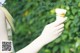 A woman holding an ice cream cone in her hand.