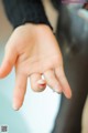 A close up of a person's hand reaching out to touch something.